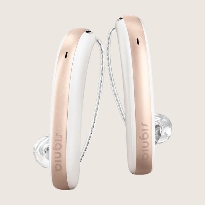 Signia Styletto hearing aids in a rosegold color