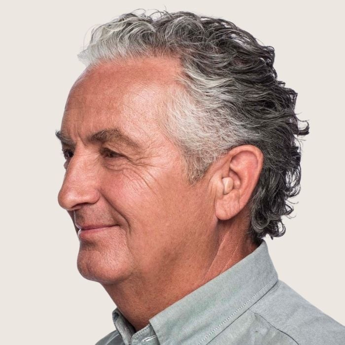 Man wearing Widex hearing aids