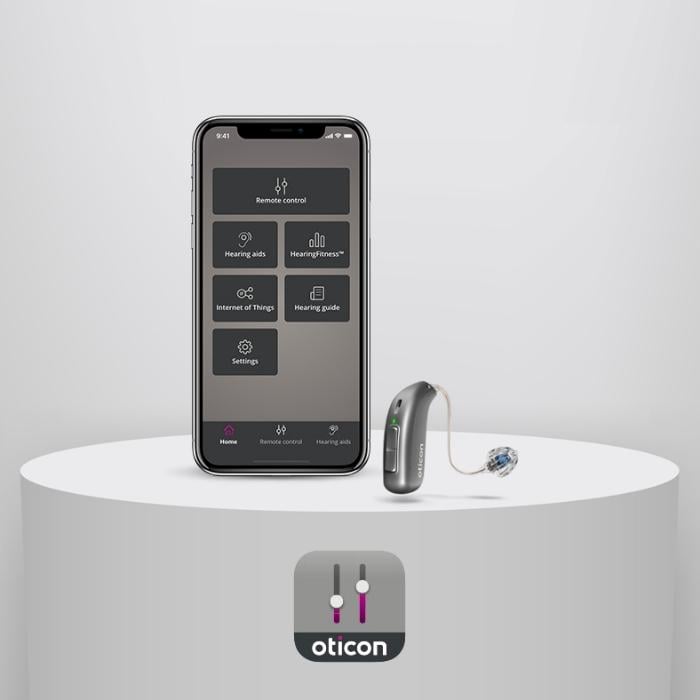 Oticon hearing aid next to Oticon app