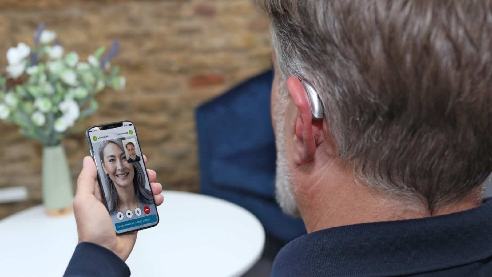 Man wearing Phonak Lumity hearing aids